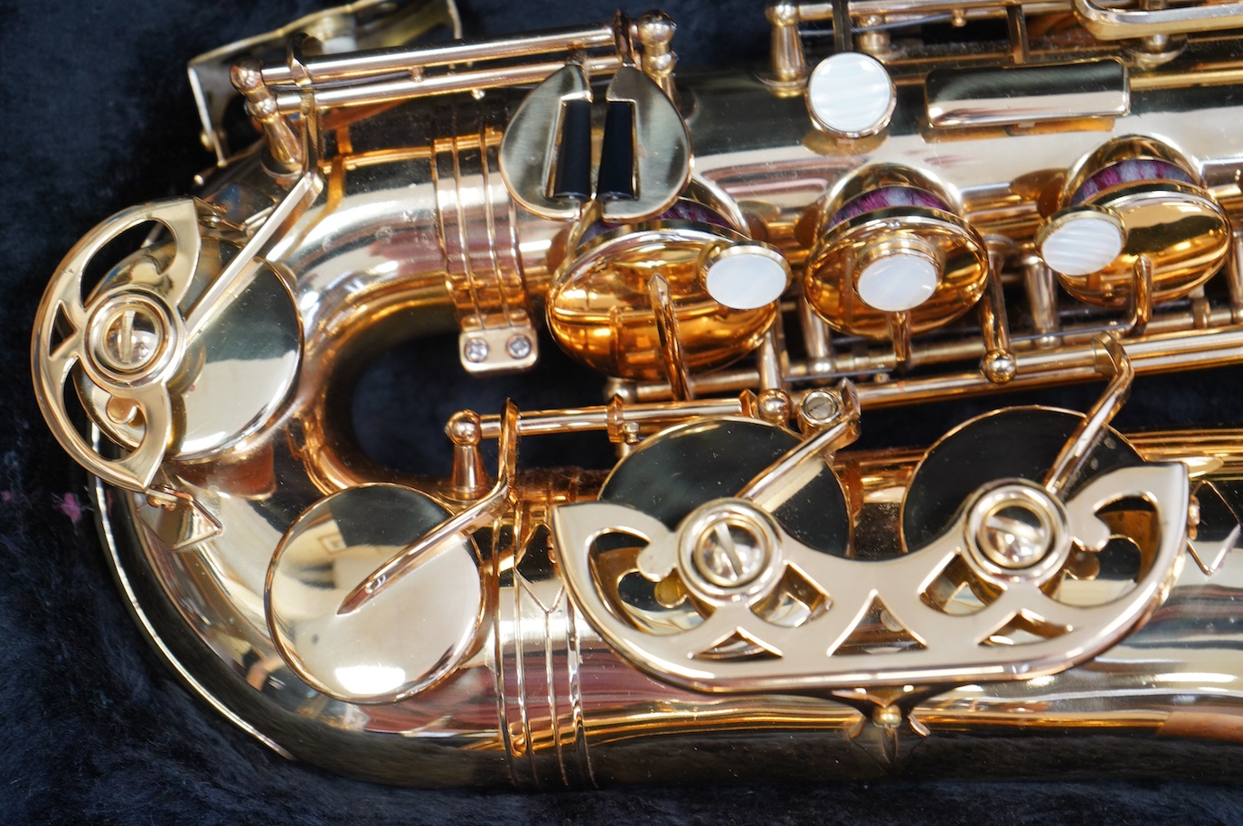 A cased Evette Buffet Crampon brass alto saxophone, together with a saxophone stand. Condition - good